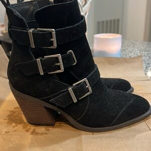 Black booties with silver buckles